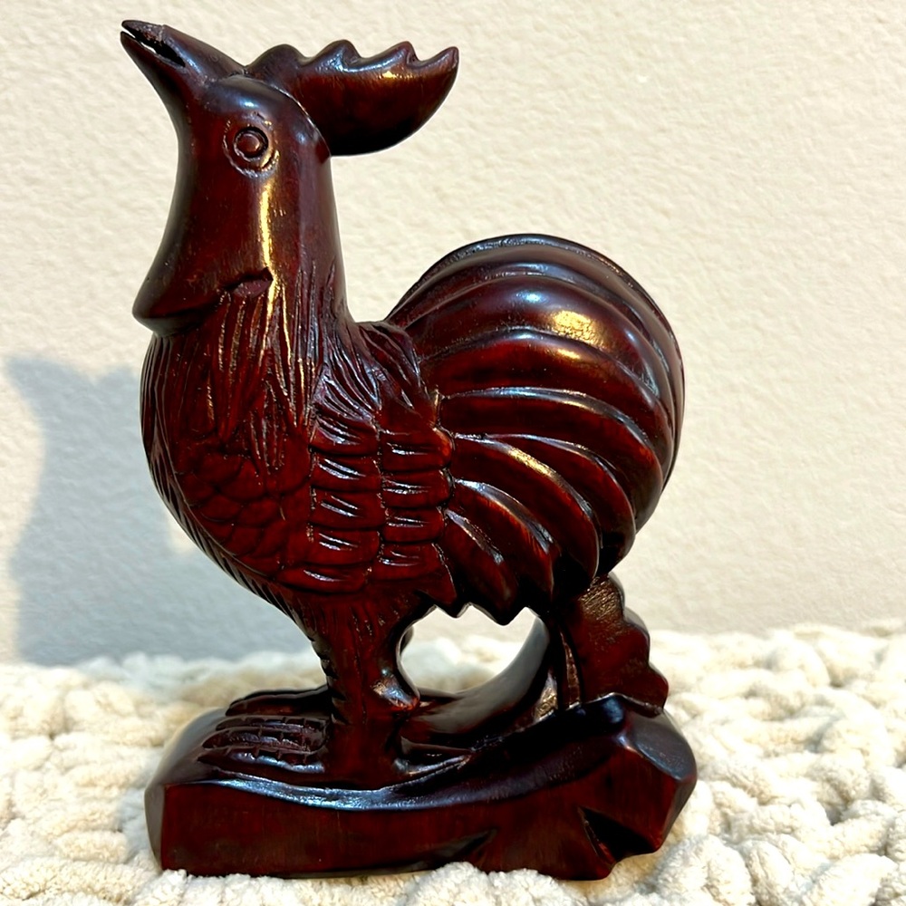 Dark red wooden rooster figurine